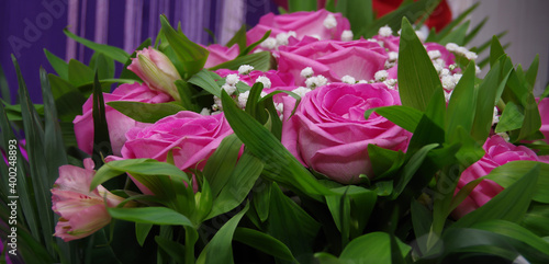 Beautiful bouquet of pink roses for birthday. Various flowers for the holiday. Close-up. Selective focus. Baner  wallpaper  postcard.