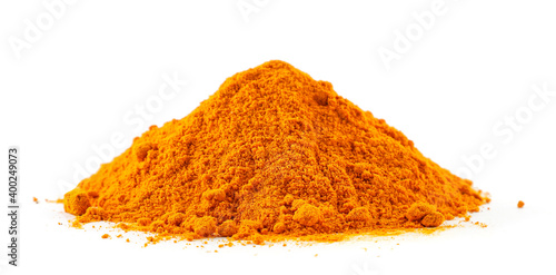 Heap of ground turmeric on a white background. Isolated