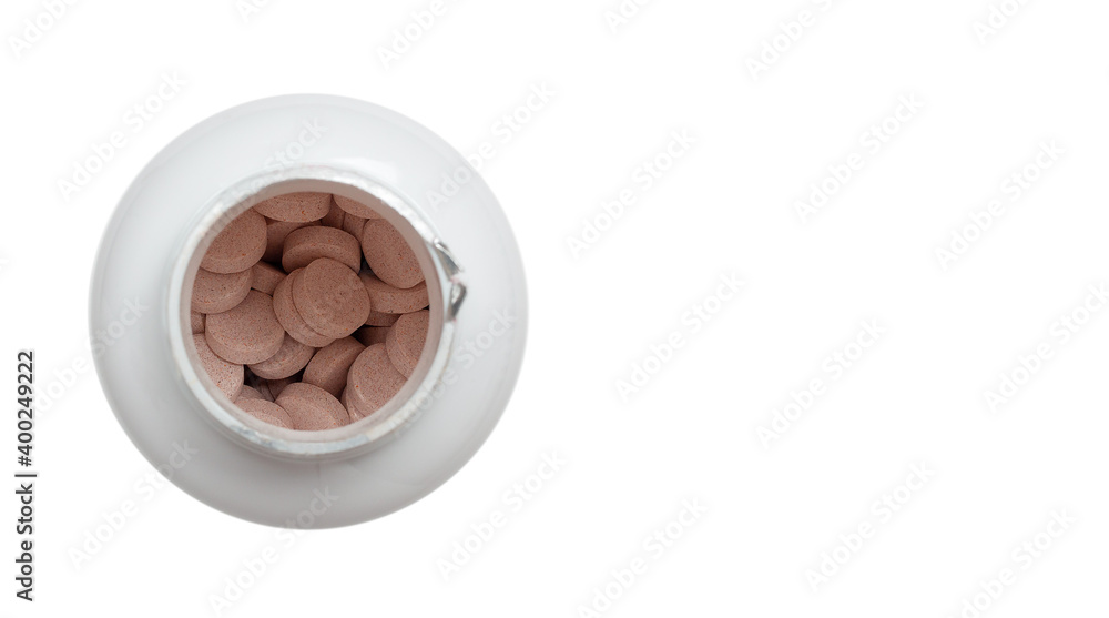 Vitamins in a plastic jar top view Vitamins in a plastic jar top view