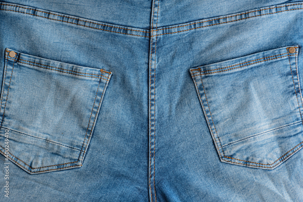 Back of classic jeans. Denim fabric. Yoke, back Pockets Back of classic jeans. Denim fabric. Yoke, back Pockets