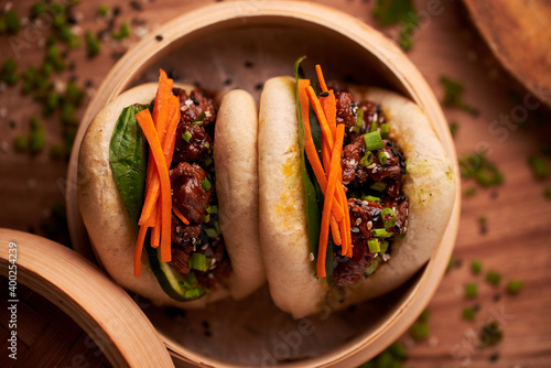 Gua bao, steamed buns with pork belly and vegetable. Asian cuisine photo