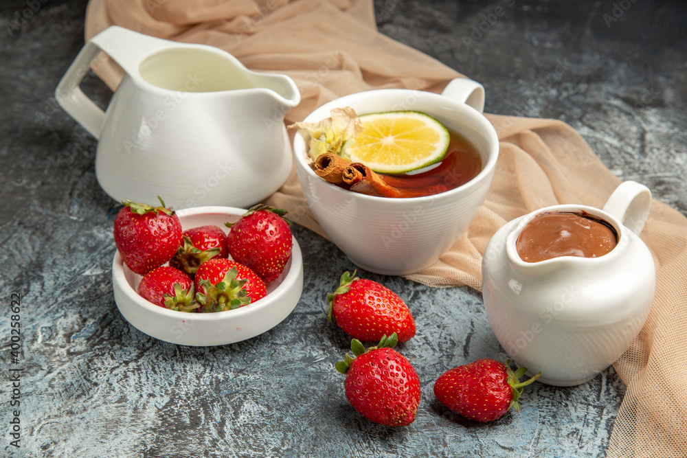 front view fresh red strawberries with cup of tea on dark-light background red fruits berry front view fresh red strawberries with cup of tea on dark-light background red fruits berry