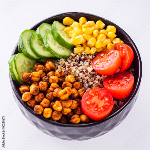 bowl of healthy quinoa with vegetables on a white background