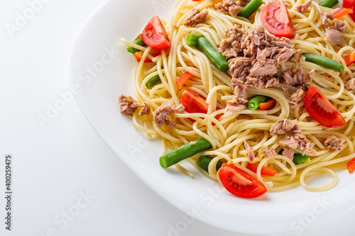 delicious traditional Italian pasta with tuna on a white background