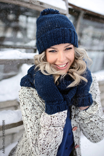Beautiful laughing woman with a perfect smile. Happy sincere winter outdoor portrait of attractive model in winter clothes.