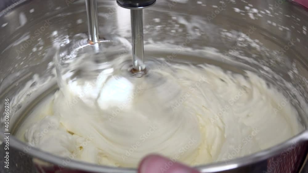 Mixing Frosting in a Kitchen Mixer Bowl Mixing Frosting in a Kitchen Mixer Bowl