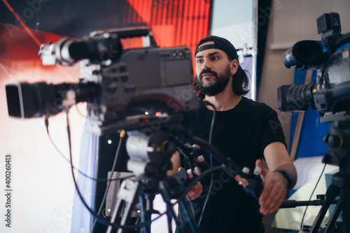 Director of photography with a camera in his hands on the set. © Anna