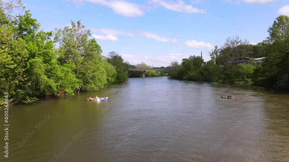 2020 - An excellent aerial shot of tourists floating down the French Broad River in Asheville, North Carolina. 2020 - An excellent aerial shot of tourists floating down the French Broad River in Asheville, North Carolina.