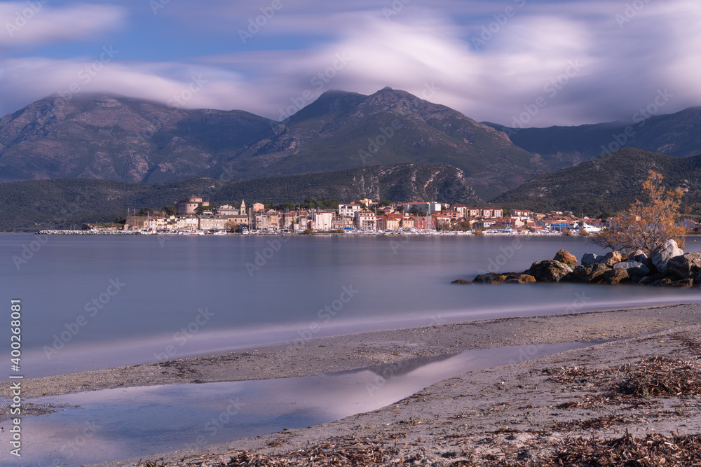 Fototapeta premium Long exposure of the village of Saint Florent, seen from La Roya beach. Corsica