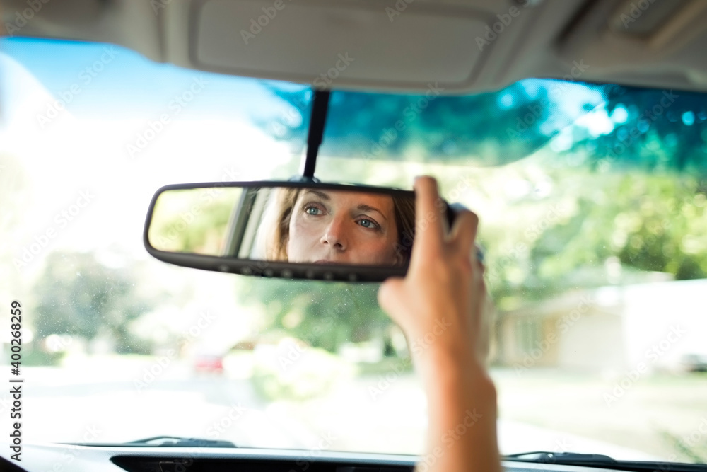 custom made wallpaper toronto digitalWoman adjusting rear-view mirror in car