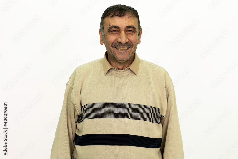 Fototapeta premium Mature male model posing at studio. White background and isolated image