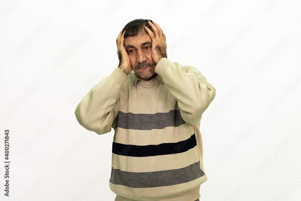 Thoughtful man. He is dressed in a yellow sweater. Isolated image, white background. Thoughtful man. He is dressed in a yellow sweater. Isolated image, white background.