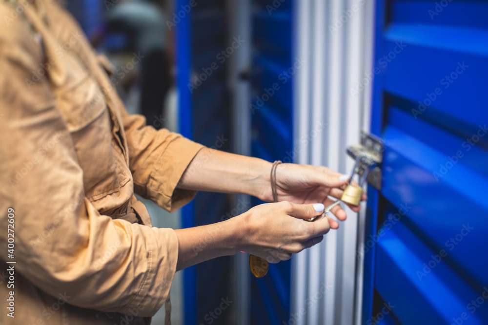 Naklejka premium View of self storage warehouse, process of keeping and storing the goods and items in storage units, self-storage building, lock and key concept