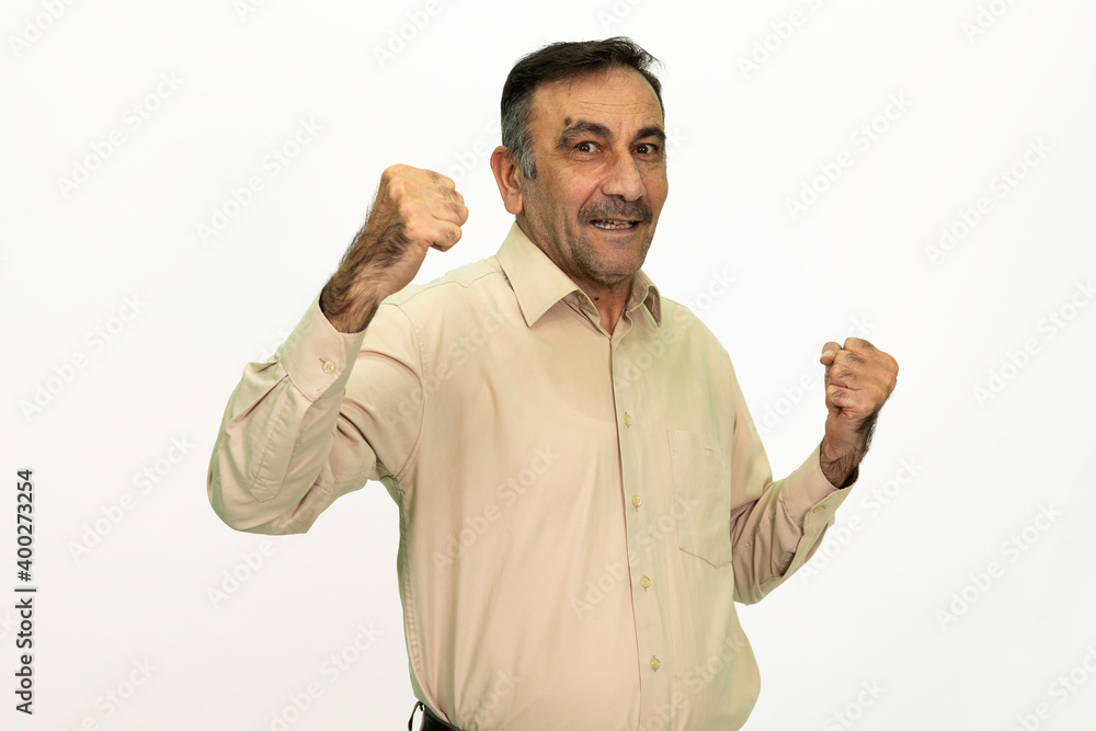 Rejoicing man. Wearing a yellow shirt. Isolated image, white background. Rejoicing man. Wearing a yellow shirt. Isolated image, white background.