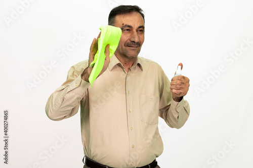 The man who cleans. You have a cleaning cloth and disinfectant on hand. Isolated image white background.