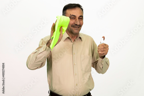 The man who cleans. You have a cleaning cloth and disinfectant on hand. Isolated image white background.
