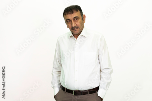 Man wearing a white shirt and fabric pants. Isolated image white background.