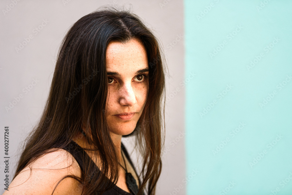 Portrait of a liberated young Arab woman with her long brown hair loose and free. Portrait of a liberated young Arab woman with her long brown hair loose and free.