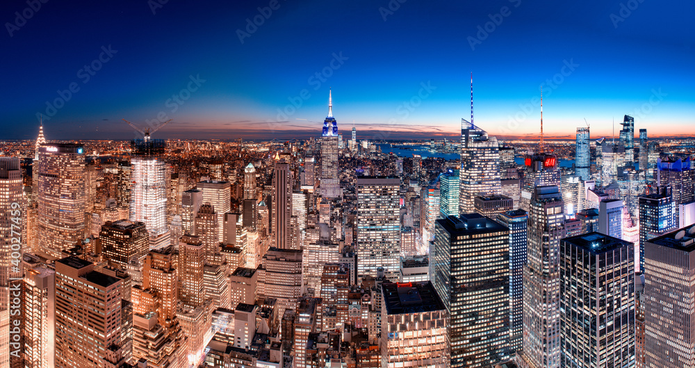 The skyline of New York City at dusk, panoramic aerial view of Manhattan