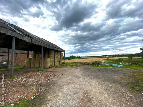 Farm outbuildings with an open hay shed, on a cloudy day on, Wintersett Lane, Wakefield, UK © derek oldfield