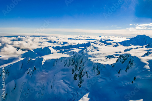 Aerial view from a helicopter. of Fox and Franz Josef Glaciers in the Southern Alps of South Island, New Zealand. 