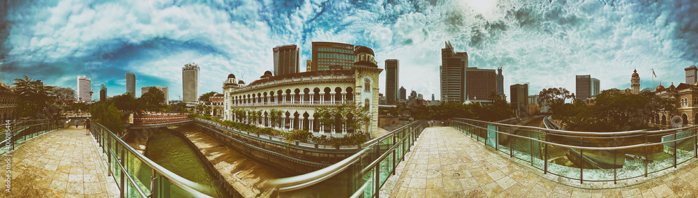 Fototapeta premium KUALA LUMPUR, MALAYSIA - DECEMBER 28, 2019: Tourists along the city streets on a beautiful sunny morning