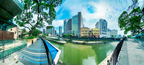 Photography KUALA LUMPUR, MALAYSIA - DECEMBER 28, 2019: Tourists along the city streets on a