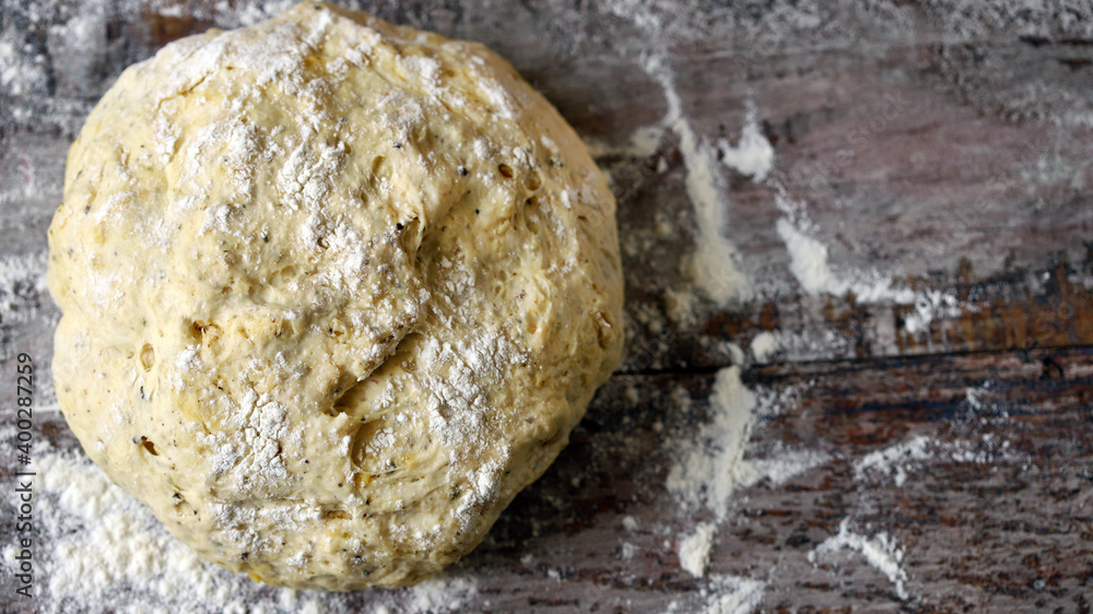Yeast dough on the table with flour. Bread making. Homemade baking. Yeast dough on the table with flour. Bread making. Homemade baking.