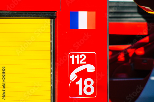 View of a red French fire engine in intervention in front of the Reims cathedral during the coronavirus pandemic affecting France and the lockdown of the country
