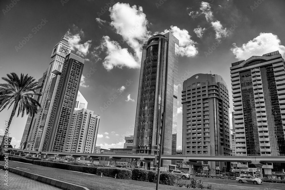 Fototapeta premium DUBAI, UAE - DECEMBER 10, 2016: Downtown city skyscrapers on a beautiful sunny day