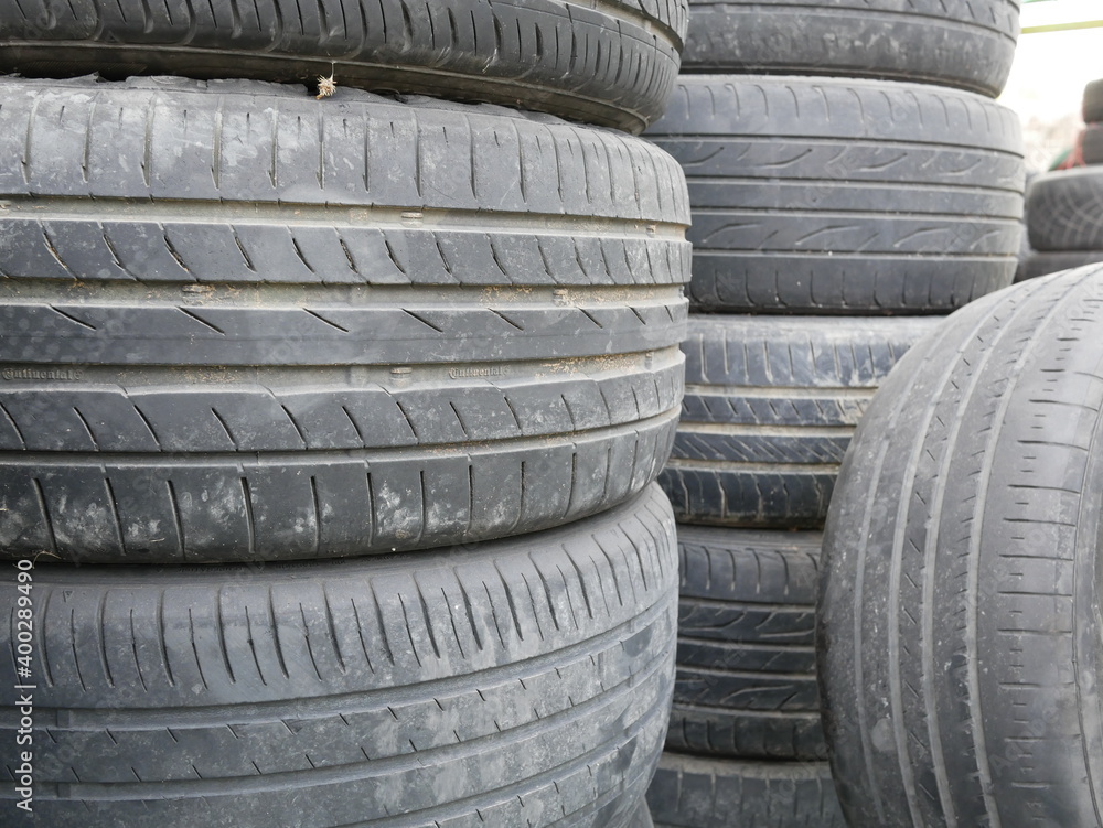 closeup pile of used car tires at garage. closeup pile of used car tires at garage.