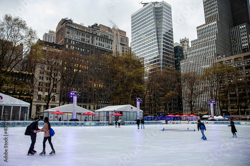 People skate in the Winter Village in Bryant Park