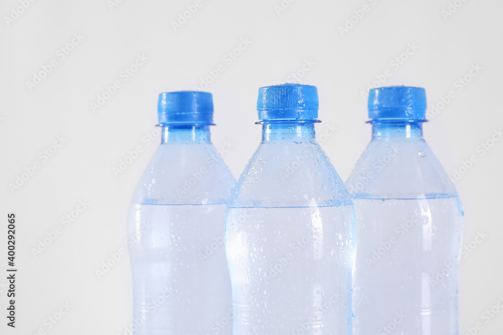 Plastic bottles with pure water on white background Plastic bottles with pure water on white background