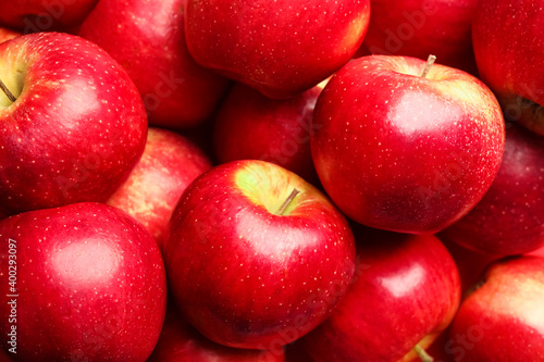 Pile of ripe red apples as background, closeup
