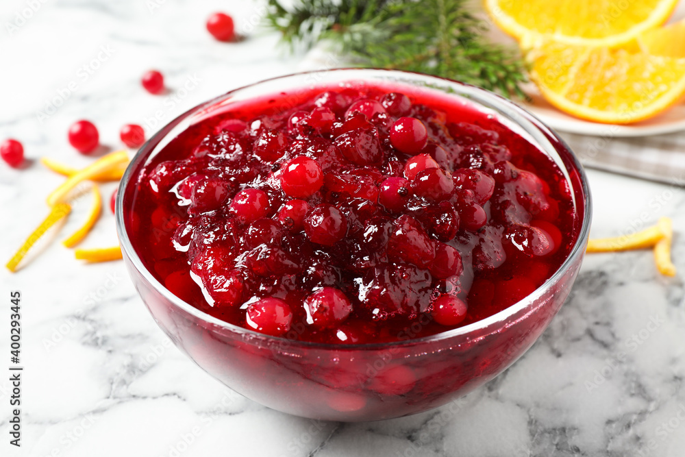 Bowl of cranberry sauce on white marble table Bowl of cranberry sauce on white marble table
