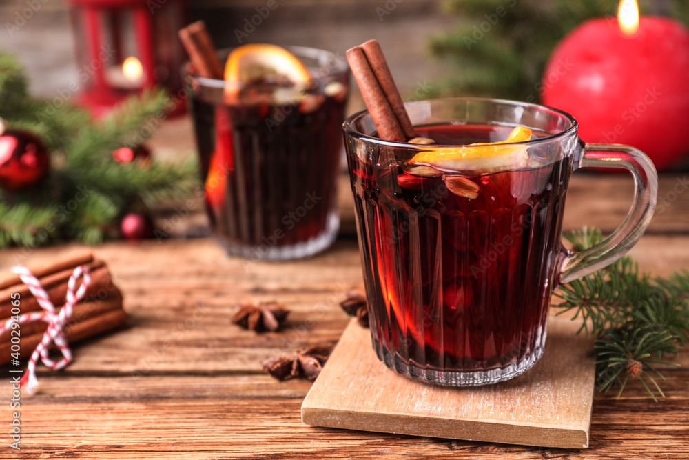 Aromatic mulled wine on wooden table, space for text Aromatic mulled wine on wooden table, space for text