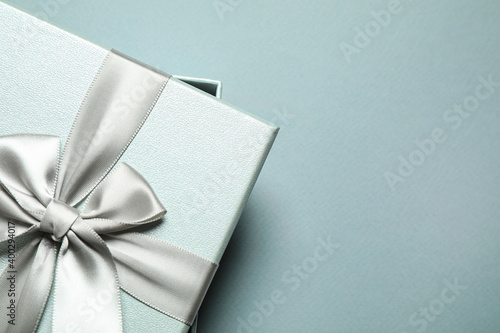 Beautiful gift box on grey background, top view. Space for text © New Africa