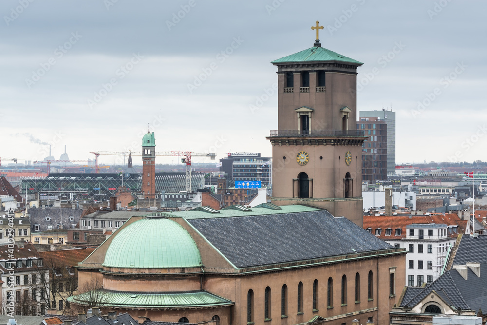 Church of Our Lady (Vor Frue Kirke), Aerial view of downtown of Copenhagen City from the The Round Tower (Rundetaarn) in rainy misty day with cloudy sky