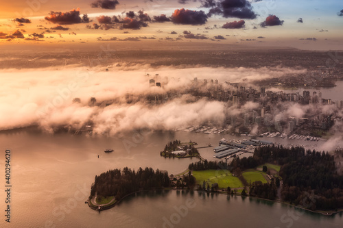 Downtown Vancouver, British Columbia, Canada. Aerial View of the Modern Urban City, Stanley Park, Harbour and Port. Viewed from Airplane Above. Colorful Sunrise Artistic Render