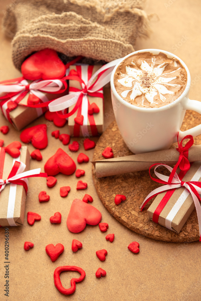 Gifts and a cup of freshly made cappuccino for Valentine's Day. Gifts and a cup of freshly made cappuccino for Valentine's Day.