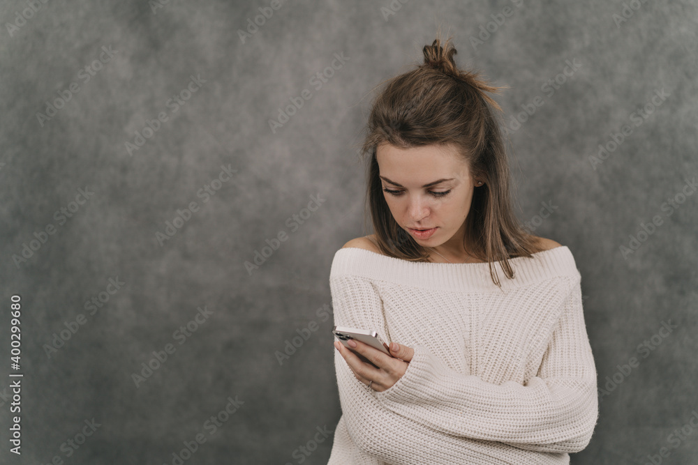 The girl holds the phone in her hands. Dependence on social networks. All life in gadgets The girl holds the phone in her hands. Dependence on social networks. All life in gadgets