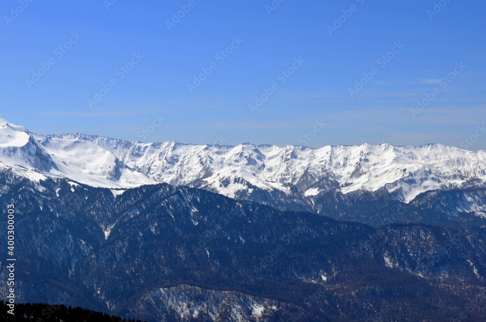 Winter landscape in the mountains with peaks and gorges, freestyle trails.