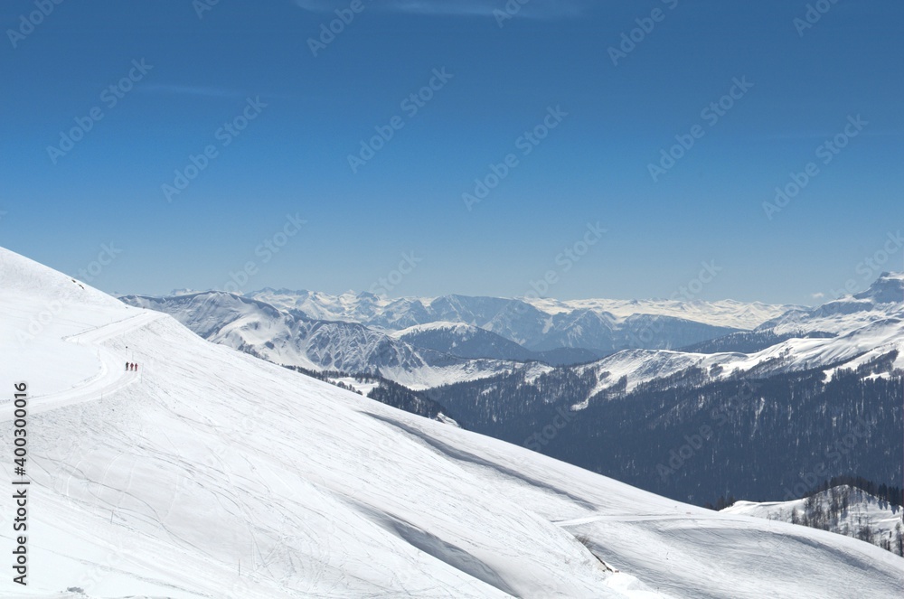Winter landscape in the mountains with peaks and gorges, freestyle trails. Winter landscape in the mountains with peaks and gorges, freestyle trails.