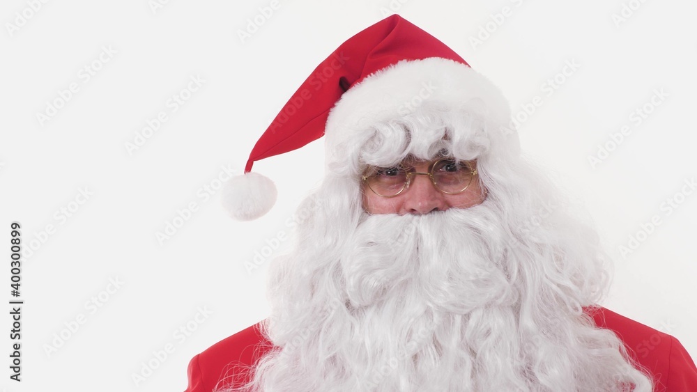 Active Cheerful Stylish Santa Claus Positively Dances, Haves Fun to Energetic Music Looking at Camera, Standing on White Background Indoors. Joyful Celebration Happy New Year, Merry Christmas Holidays
