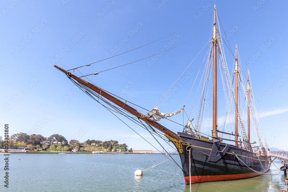 San Francisco, CA, USA - April  2, 2018:  Historical ship C.A. Thayer at Hyde St. Pier in San Francisco, California. The Hyde Street Pier is a historic ferry pier amidst the tourist zone of Fisherman