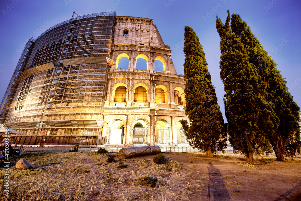 Fototapeta premium The Colosseum and the homonymous square at summer sunset, Rome, Italy