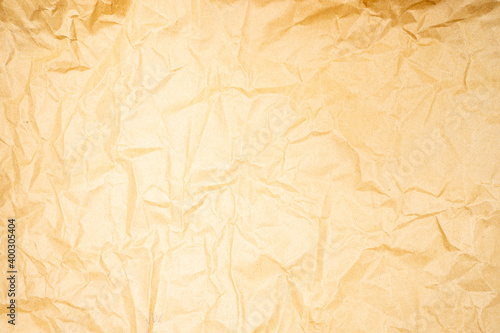 Golden wrinkle paper texture for use as a background.