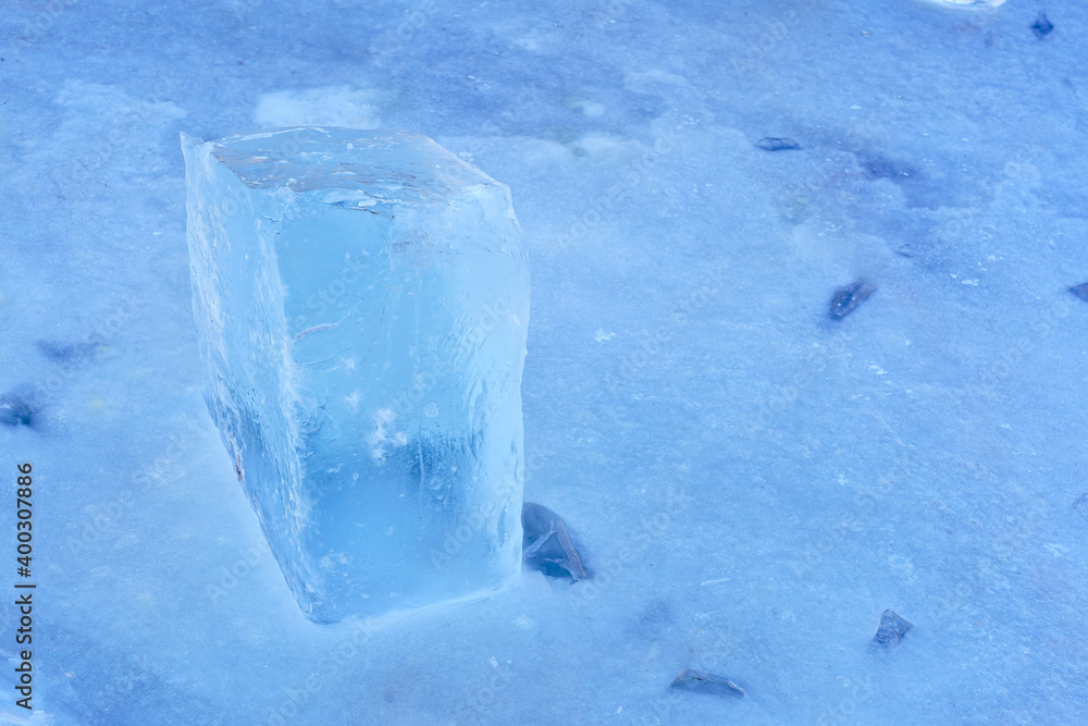 Fresh ice cube on the river as a material for building ice sculptures in winter Fresh ice cube on the river as a material for building ice sculptures in winter