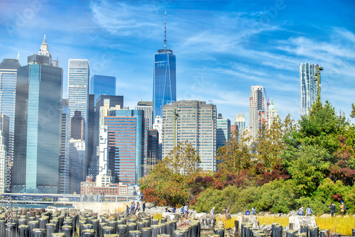 NEW YORK CITY - OCTOBER 2015: View of Downtown Manhattan Skyscrapers from Brooklyn Bridge Park on a beautiful autumn day