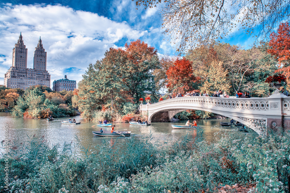 NEW YORK CITY - OCTOBER 2015: Central Park Foliage and Bow Bridge in Manhattan on a beautiful autumn day